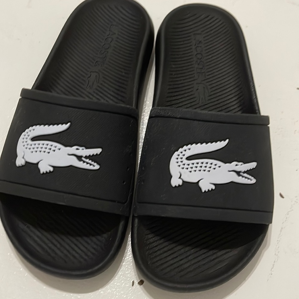 Black Lacoste slides